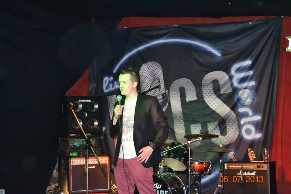 Independent musician performing live at music community event.